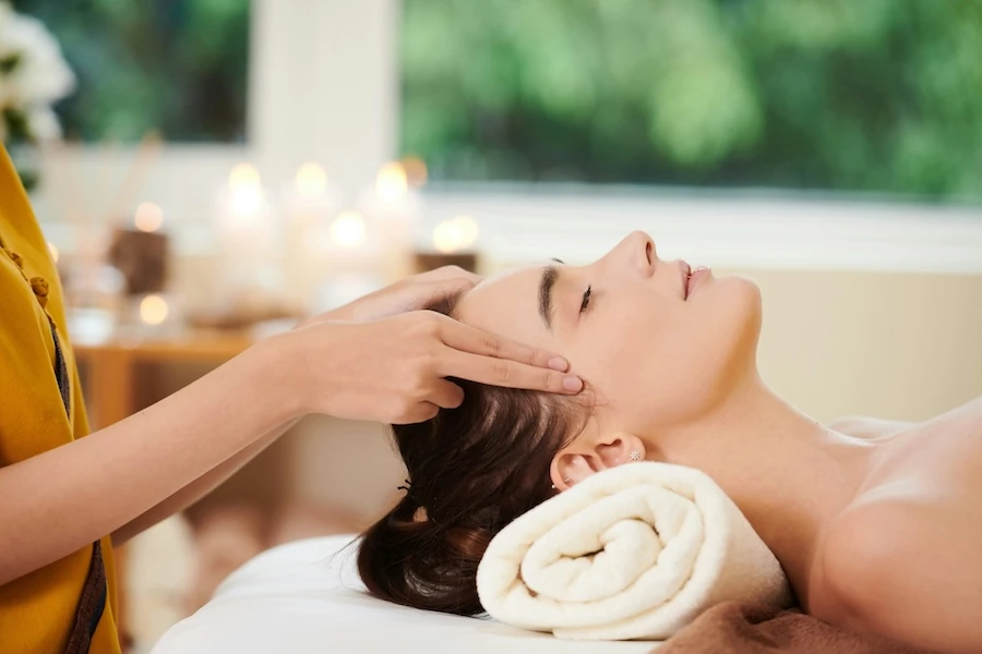 woman relaxing healing facial massage